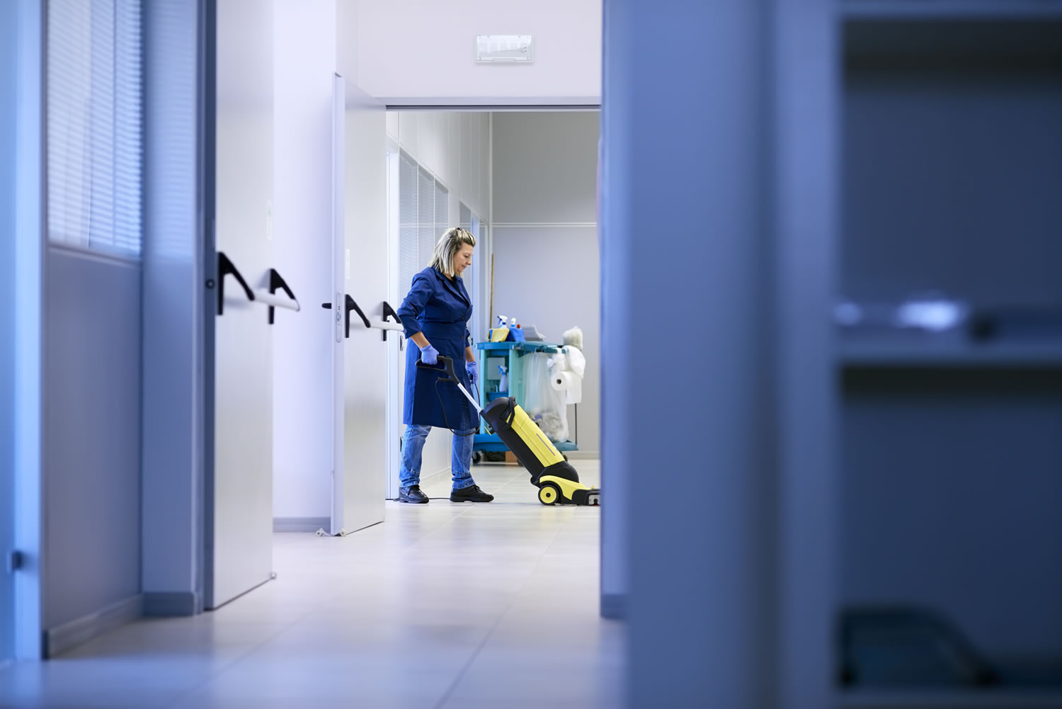 Professionals rendering janitorial services in an office in Rhode Island.